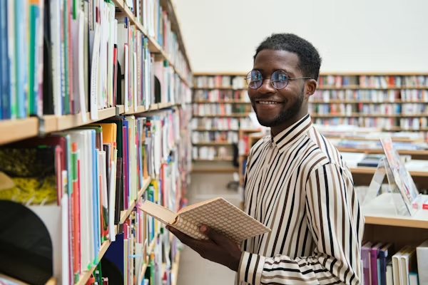African student engaged in learning in a library