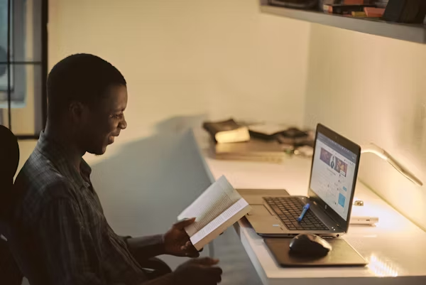 African professional studying with digital technology
